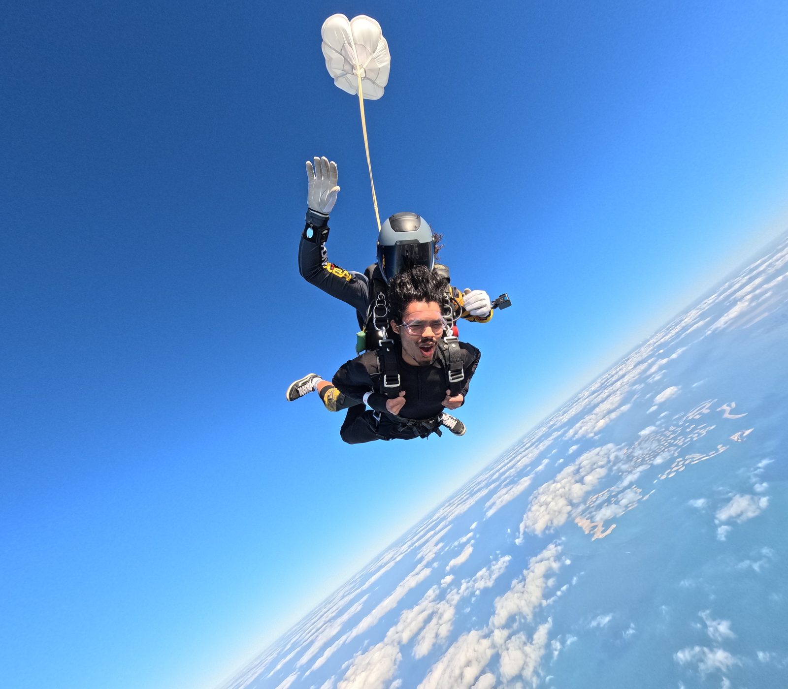 Aatmik Panse tandem skydiving in freefall over the coast of Dubai